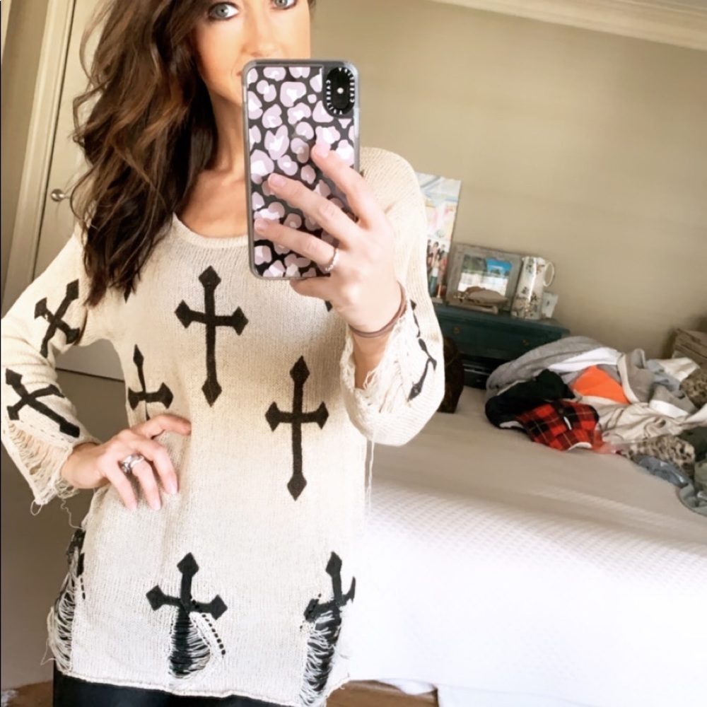 Edgy cross sweater